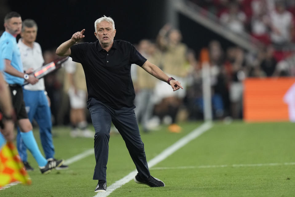 FILE - Roma's head coach Jose Mourinho shouts during the Europa League final soccer match between Roma and Sevilla at the Puskas Arena stadium in Budapest, Hungary, Wednesday, May 31, 2023. English referee Anthony Taylor and his family had to be escorted away by security at an airport in Hungary after outraged Roma fans directed insults at him and threw a chair in his direction following this year’s Europa League final. Roma largely blamed Taylor for its penalty shootout loss to Sevilla, with coach Mourinho lashing out at him in the post-match news conference. (AP Photo/Darko Bandic, File)