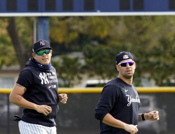 FILE - New York Yankees' Gary Sanchez, right, and Gio Urshela, left, take part in a spring training baseball workout Feb. 22, 2021, in Tampa, Fla. The Yankees have acquired former AL MVP Josh Donaldson and shortstop Isiah Kiner-Falefa from the Minnesota Twins for catcher Sanchez and third baseman Urshela. (AP Photo/Frank Franklin II, File)