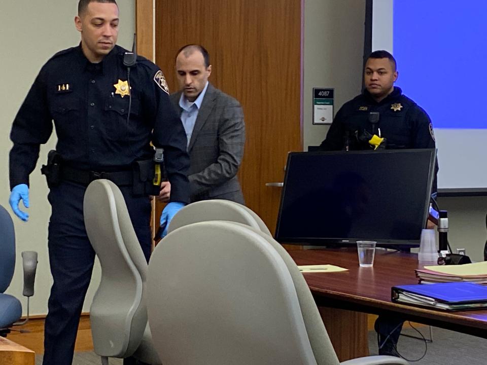 Michael Soares, 37, is led into court Wednesday afternoon. Soares' murder trial began Wednesday morning and wrapped up Friday.