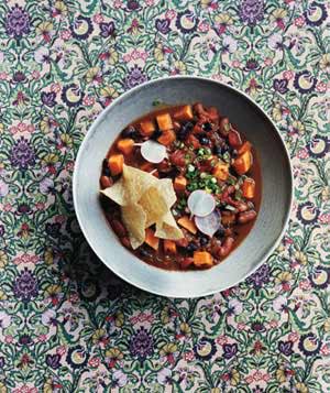 <p>The secret ingredient in this slow-cooker vegetarian chili recipe will knock your game-day socks off. The meal is loaded with sweet potatoes, bell peppers, and not one, but two kinds of beans. Set the toppings in separate bowls and have everyone line up buffet-style to serve themselves.</p> <p> <strong>Get the recipe:</strong> <a rel="nofollow noopener" href="https://www.realsimple.com/food-recipes/browse-all-recipes/slow-cooker-vegetarian-chili-with-sweet-potatoes-00000000049528" target="_blank" data-ylk="slk:Slow-Cooker Vegetarian Chili With Sweet Potatoes;elm:context_link;itc:0;sec:content-canvas" class="link ">Slow-Cooker Vegetarian Chili With Sweet Potatoes</a></p>