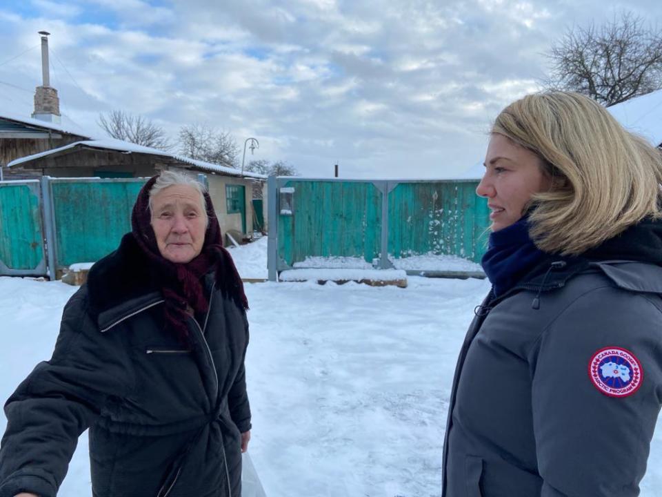 Nina Belaya, left, who lives in a Ukrainian village near the border with Russia, speaks with CBS News correspondent Holly Williams. / Credit: CBS News