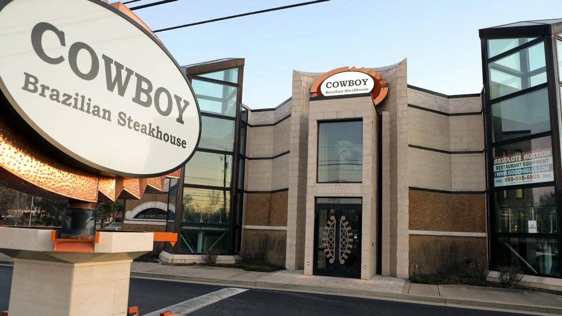 One of Lexington’s most unique and largest restaurant buildings at 2041 Richmond Road, sits empty Tuesday, Dec. 19, 2023, in Lexington, Ky. with absolute auction signs in its windows for the restaurant’s equipment. The restaurant was home for two Lexington dining spots that ultimately closed. Originally opened in March 2013 as Coba Cocina, the building was known for its jellyfish tank, but the restaurant closed after three years of operation. Cowboy Brazilian Steakhouse opened in fall 2018 and closed less than a year later. The building has sat empty since then.