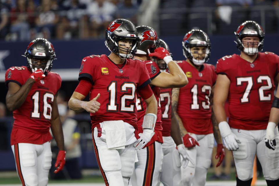 Tampa Bay Buccaneers quarterback Tom Brady (12) signals to the sideline as he stands by the offense on the field in the second half of a NFL football game in Arlington, Texas, Sunday, Sept. 11, 2022. (AP Photo/Michael Ainsworth)