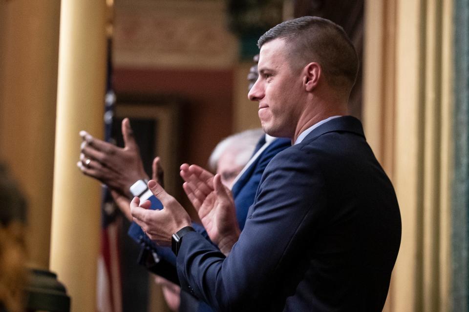 Then-Michigan House Speaker Lee Chatfield applauds during the State of the State address at the State Capitol in Lansing, Wednesday, Jan. 29, 2020. Chatfield and his wife, Stephanie, have been charged with felonies related to alleged financial impropriety while Lee Chatfield was in office.