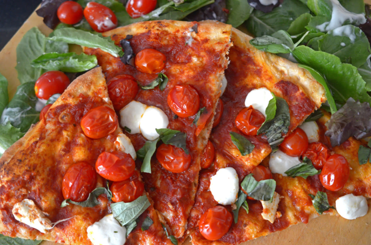 <p>Platter Talk</p><p>This pizza Margherita echoes back to the classic Italian pie originally created for a visiting queen. Our version uses all of the basic elements of the original, with two big additions: convenience and ease! </p><p><strong>Get the recipe: <a href="/841371/danzehr/pizza-margherita-fast-and-easy-only-20-minutes-from-prep-to-first-bite/" data-ylk="slk:Easy Pizza Margherita;elm:context_link;itc:0;sec:content-canvas" class="link rapid-noclick-resp">Easy Pizza Margherita</a></strong></p><p><strong>Related: <a href="https://parade.com/848273/kathypatalsky/12-veggie-pizza-party-recipes/" rel="nofollow noopener" target="_blank" data-ylk="slk:12 Veggie Pizza Party Recipes;elm:context_link;itc:0;sec:content-canvas" class="link rapid-noclick-resp">12 Veggie Pizza Party Recipes</a></strong></p>