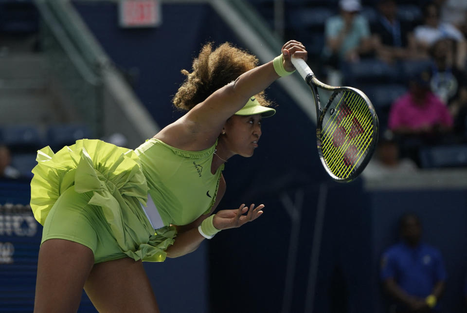 Japan's Naomi Osaka serves to Latvia's Jelena Ostapenko during their women's singles first round match on the second day of the US Open tennis tournament at the USTA Billie Jean King National Tennis Center in New York City, on August 27, 2024. (Photo by TIMOTHY A. CLARY / AFP) (Photo by TIMOTHY A. CLARY/AFP via Getty Images)