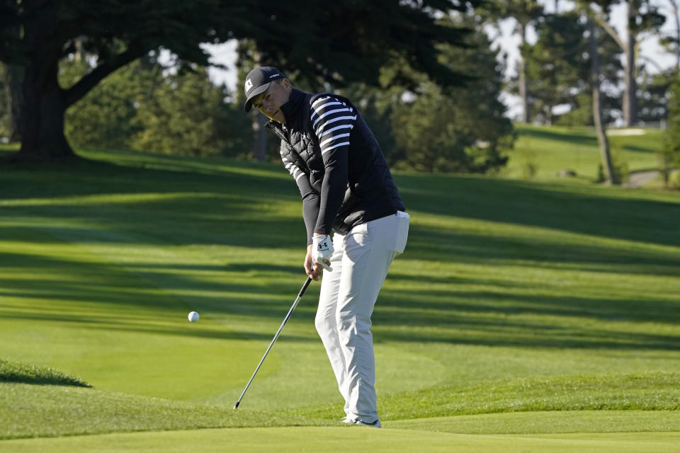 Jordan Spieth chips the ball onto the 10th green of the Spyglass Hill Golf Course during the second round of the AT&T Pebble Beach Pro-Am golf tournament Friday, Feb. 12, 2021, in Pebble Beach, Calif. (AP Photo/Eric Risberg)