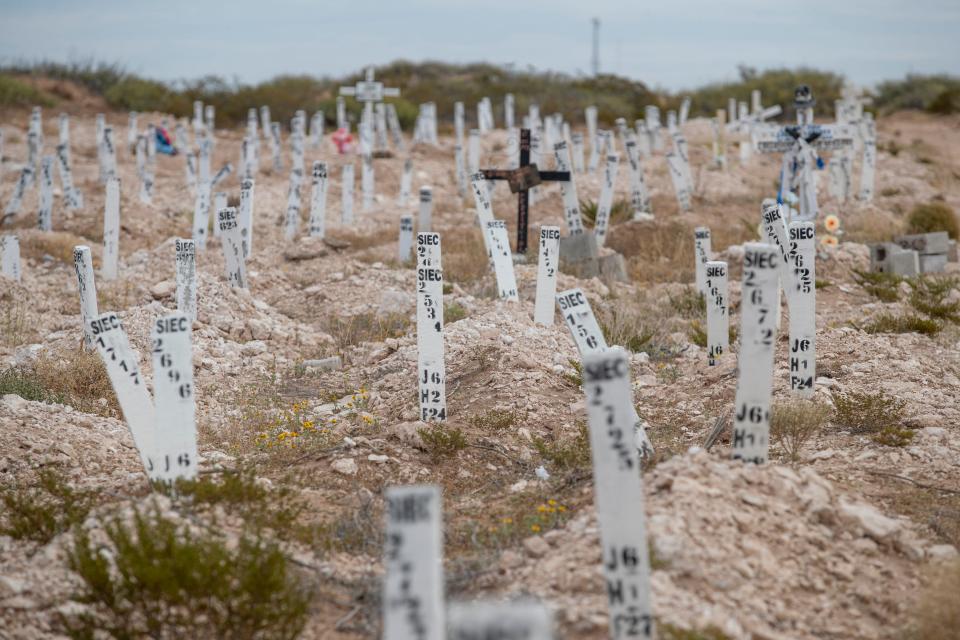 A lone cross stands amid the stakes of unidentified graves at the San Rafael Municipal Cemetery in Juárez. The cross is an indication that a body might have been successfully identified but the body was not exhumed for unknown reasons.