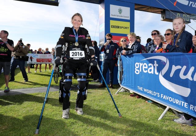 Claire Lomas crosses the finish line in her robotic suit during the Great North Run in Newcastle 