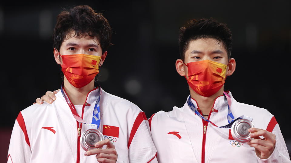 Tokyo 2020 Olympics - Badminton - Men's Doubles - Medal Ceremony - MFS - Musashino Forest Sport Plaza, Tokyo, Japan – July 31, 2021. Silver medallists Li Junhui of China and Liu Yuchen of China pose with their medals. REUTERS/Leonhard Foeger