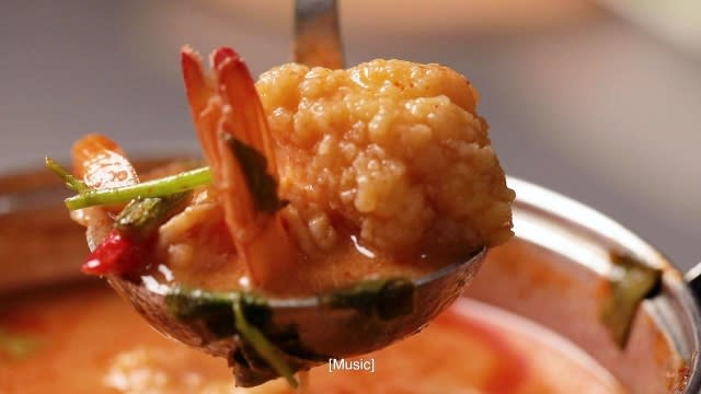 Tom yum soup with generous amount of seafood such as prawns, mussels, sotong