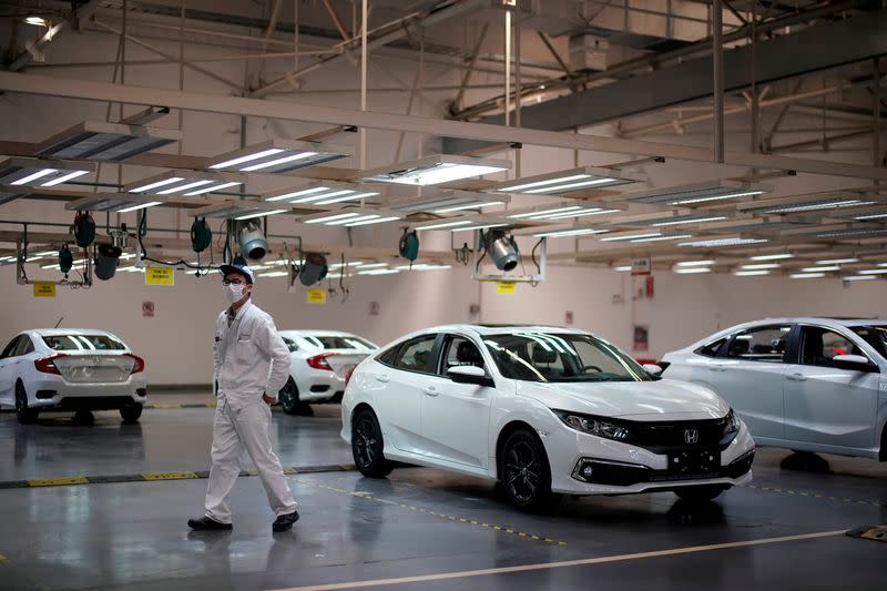 FILE PHOTO: Employee is seen on a production line inside a Dongfeng Honda factory in Wuhan