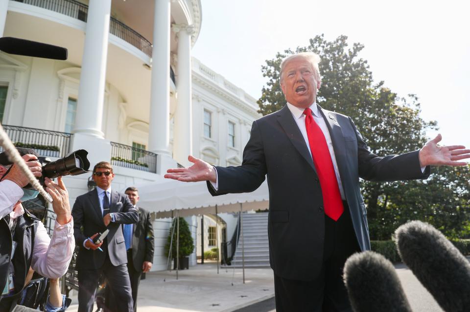 U.S. President Donald Trump talks to reporters as he walks to the Marine One helicopter while heading out on a day trip to Arizona and a visit to the U.S.-Mexico border, departing from the South Lawn of the White House in Washington, U.S., June 23, 2020. REUTERS/Tom Brenner