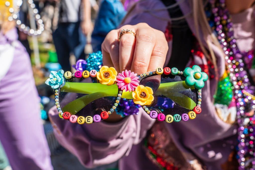 krewe of iris sunglasses decorated with flower shaped beads, letter beads spell out i can buy myself flowers