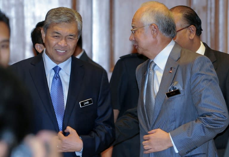 Malaysia's Prime Minister Najib Razak (R) chats with his newly-appointed Deputy Prime Minister Ahmad Zahid Hamidi (L) at the premier's office in Putrajaya on July 28, 2015