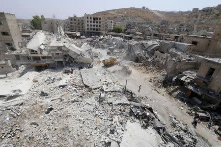 A general view shows the damage after a Syrian army fighter jet crashed into a busy marketplace in the rebel-held northwestern town of Ariha August 3, 2015. REUTERS/Ammar Abdullah