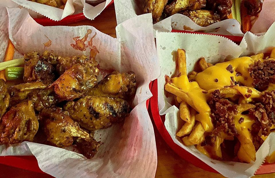 Garlic parmesan wings and loaded fries from South Turn.