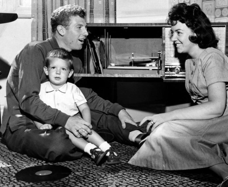 Colin Grainger with his wife Doreen and son Colin listening to one of his records in 1960.