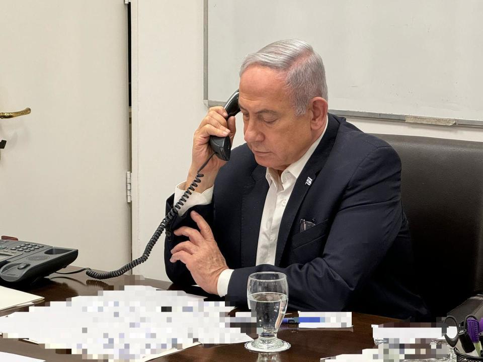 (240414) -- TEL AVIV, April 14, 2024 (Xinhua) -- This photo released on April 14, 2024 shows Israeli Prime Minister Benjamin Netanyahu making a phone call with U.S. President Joe Biden. U.S. President Joe Biden told Israeli Prime Minister Benjamin Netanyahu during a call on Saturday that the United States will oppose any Israeli counterattack against Iran, U.S. news portal Axios reported, citing a senior White House official. (GPO/Handout via Xinhua)