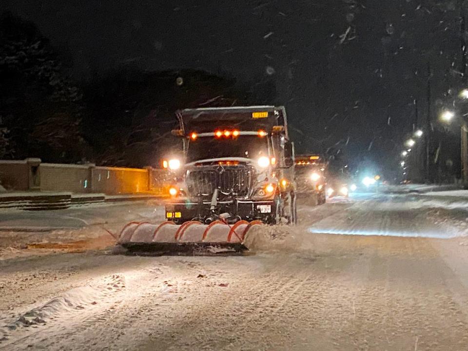 A Wichita snow plow clears 135th St. W. near Central on the evening of November 25.