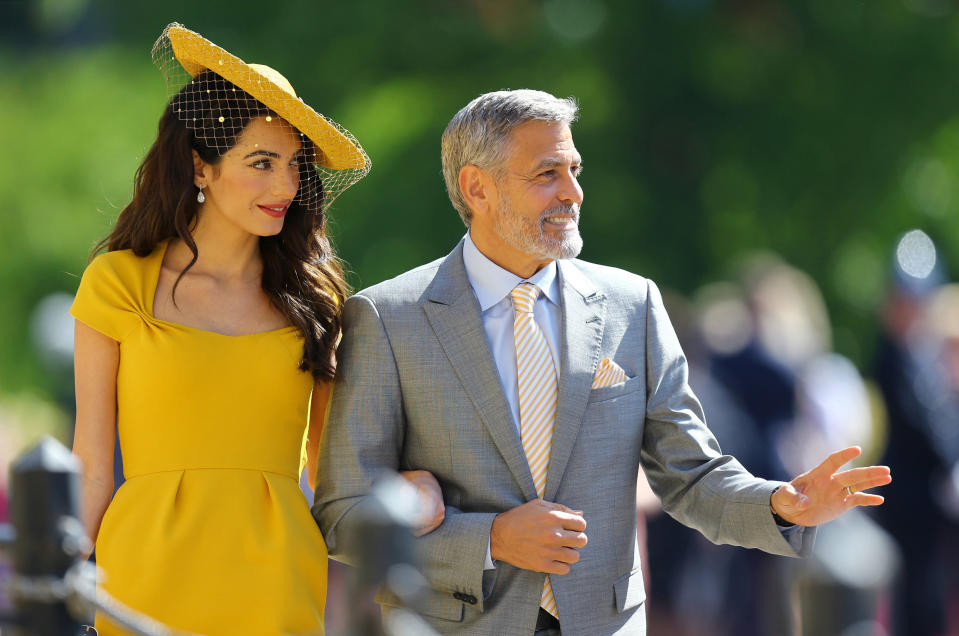 WINDSOR, UNITED KINGDOM - MAY 19:  Amal Clooney and George Clooney arrive at St George's Chapel at Windsor Castle before the wedding of Prince Harry to Meghan Markle on May 19, 2018 in Windsor, England. (Photo by Gareth Fuller - WPA Pool/Getty Images)