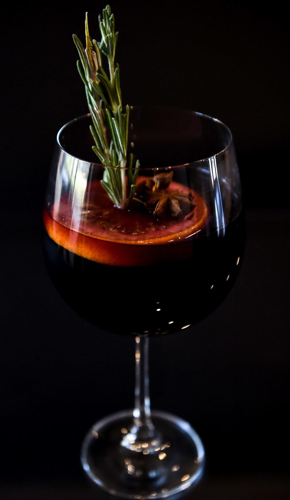 Mulled wine made with cinnamon, star anise and oranges is a warm, spicy cocktail for the holiday season and features local honey from Jackson's Footprint Farms.