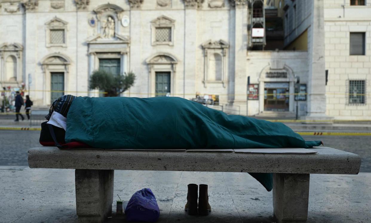 <span>A homeless person in Italy, where voters’ top priority was jobs and support for the economy.</span><span>Photograph: Vincenzo Pinto/AFP/Getty Images</span>