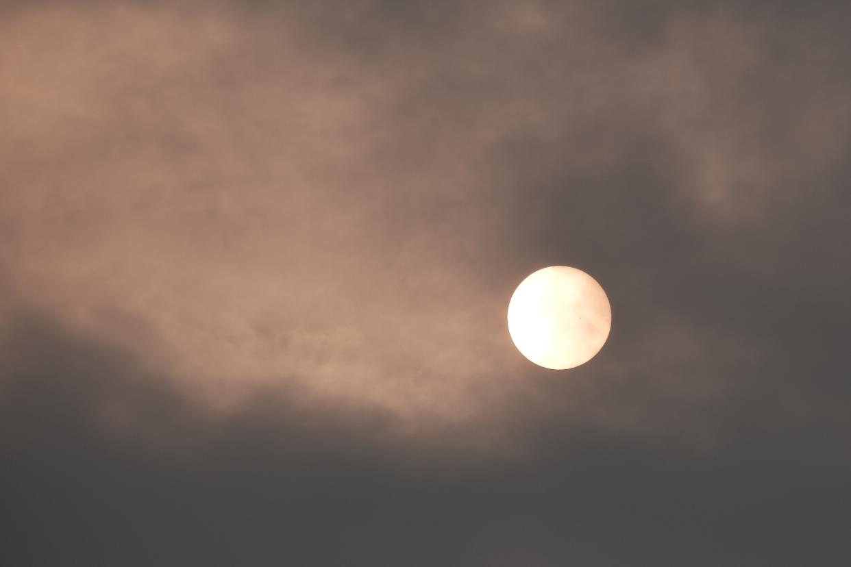 The sun over New York City takes on a red appearance on a hazy morning resulting from Canadian wildfires (Getty Images)