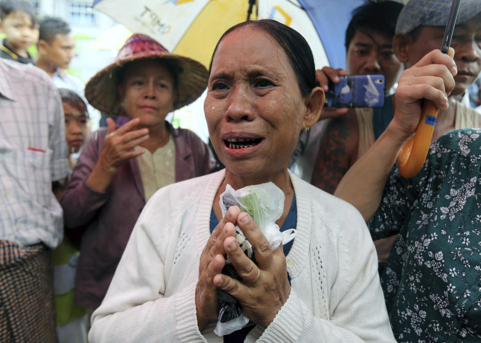 Daw Yee, mother of rape suspect Aung Kyaw Myo, talks to journalists after the trial of her son at a court Wednesday, July 24, 2019, in Nyapyitaw, Myanmar. A Myanmar court held another hearing related to the rape of a 2-year old girl at her nursery school, in a case that generated huge interest and protests. (AP Photo/Aung Shine Oo)