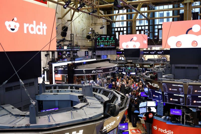 Reddit CEO Steve Huffman stands with traders and other attendees before trading on Reddit stock opened on the floor of the New York Stock Exchange on Thursday. Photo by John Angelillo/UPI