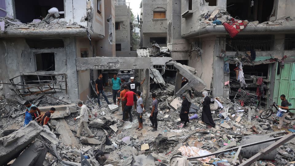 Palestinians inspect the damage a day after Israeli forces launched an operation to rescue four hostages, in Nuseirat, central Gaza, on June 9. - Eyad Baba/AFP/Getty Images