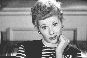 Lucille Ball cringing and turning away from the camera