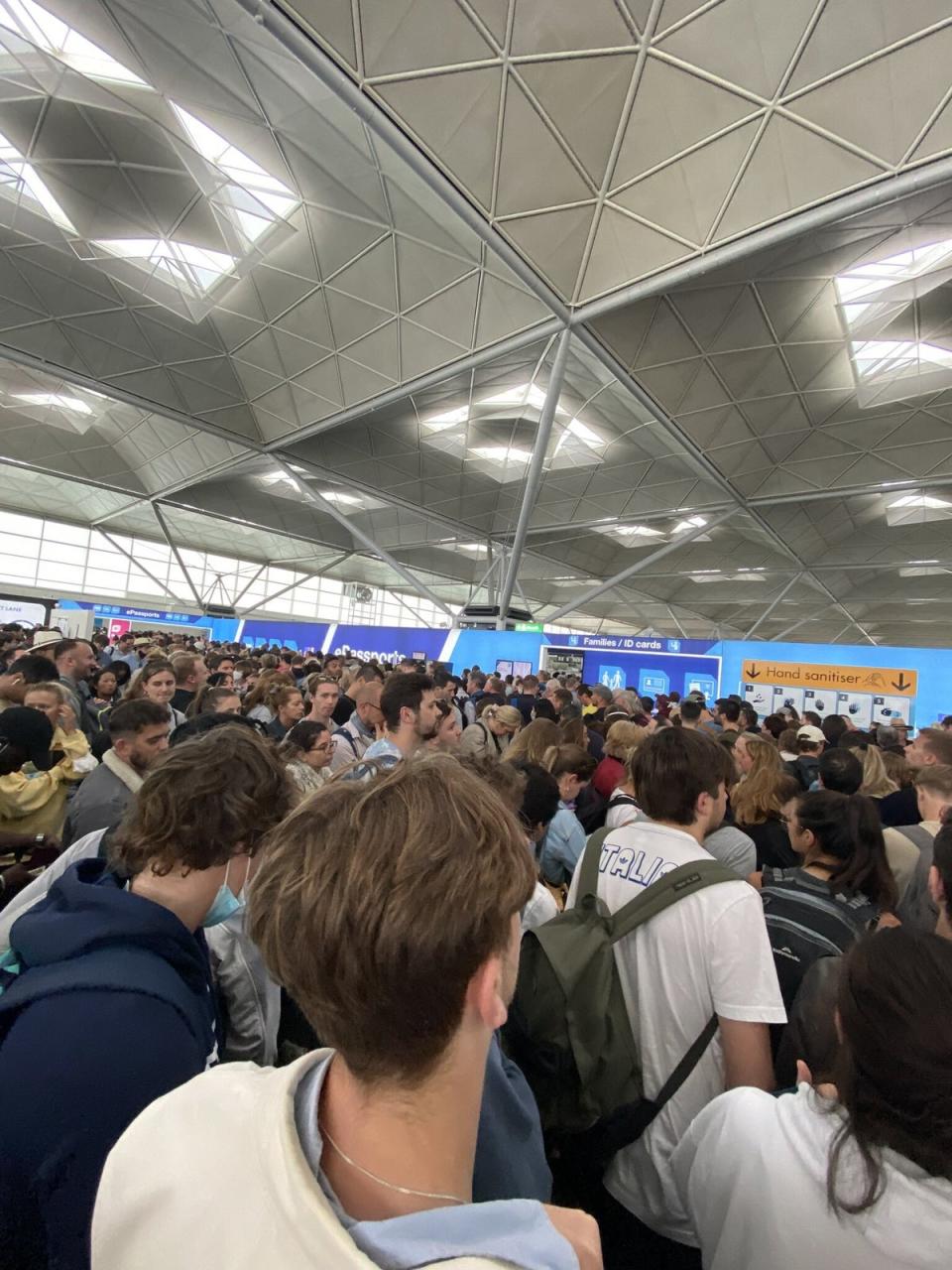 People queuing at Stansted airport (@CJvsn) (PA Media)