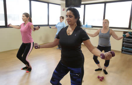 Dr. Anu Puttagunta (C), endocrinologist, participates with hospital staff in a MOVE exercise class at Saint Joseph Mercy hospital in Ypsilanti, Michigan, U.S., August 23, 2017. Picture taken August 23, 2017. REUTERS/Rebecca Cook