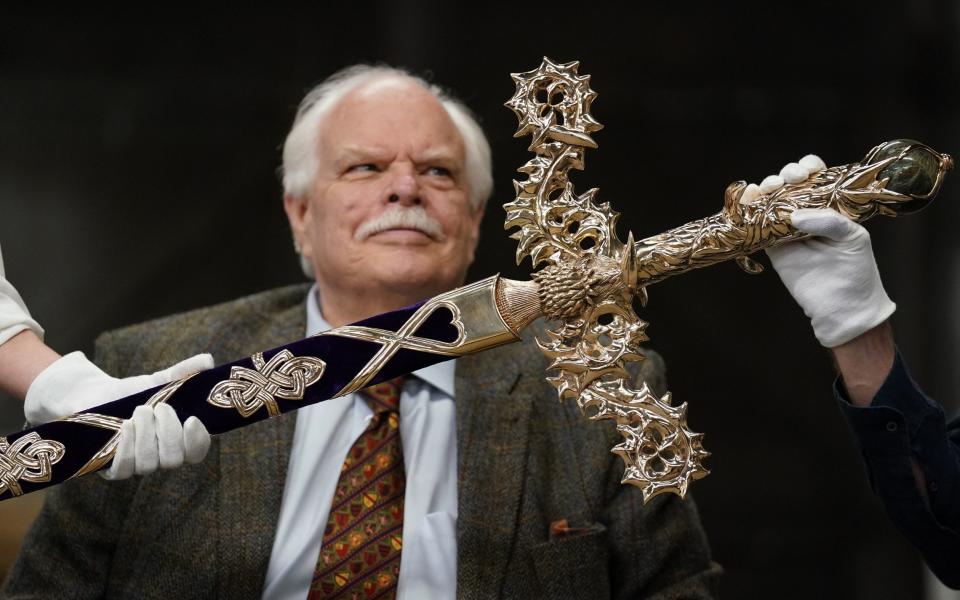 Sword designer Mark Dennis views the Elizabeth sword which will form part of the Honours of Scotland