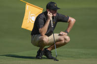 Taylor Pendrith, of Canada, lines up a putt on the fifth green during practice for the Presidents Cup golf tournament at the Quail Hollow Club, Tuesday, Sept. 20, 2022, in Charlotte, N.C. (AP Photo/Chris Carlson)