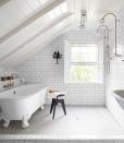 <p>In the bathroom of this in this <a href="https://www.countryliving.com/remodeling-renovation/home-makeovers/g1505/pennsylvania-diy-home-renovation/#" rel="nofollow noopener" target="_blank" data-ylk="slk:Pennsylvania home;elm:context_link;itc:0;sec:content-canvas" class="link ">Pennsylvania home</a>, a Victoria + Albert tub sits opposite the showers, all finished with fittings from Habitat, a local hardware store. The hanging basket, once used by miners, holds toiletries.</p>