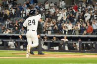 New York Yankees' Alex Verdugo (24) points to the sky while approaching home base after hitting a home run in the second inning of a baseball game, Tuesday, April 9, 2024, in New York. (AP Photo/Peter K. Afriyie)