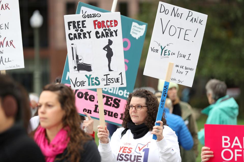 A supporter of Issue 1, the Right to Reproductive Freedom amendment, attends a rally held by Ohioans United for Reproductive Rights at the Ohio Statehouse in Columbus, Ohio, on Oct. 8, 2023. As campaigning escalates in Ohio's fall fight over abortion rights, a new line of attack from opponents suggests "partial-birth" abortions would be revived if a proposed constitutional amendment passes.