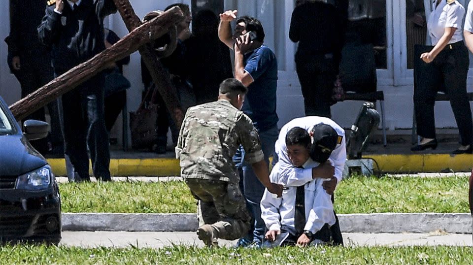 A relative breaks down after being told of an explosion. Source: Getty