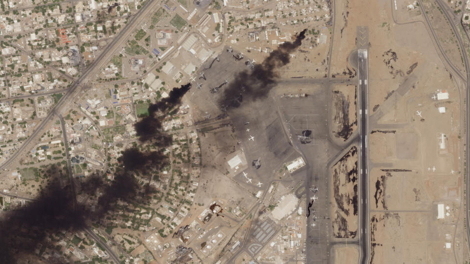 This satellite photo from Planet Labs PBC shows fires burning at Khartoum International Airport in Khartoum, Sudan, Wednesday, April 19, 2023. Explosions and heavy gunfire rattled the Sudanese capital in a fifth day of fighting Wednesday after an internationally brokered truce quickly fell apart. The cease-fire failure suggested the two rival generals fighting for control of the country were determined to crush each other in a potentially prolonged conflict. (Planet Labs PBC via AP)