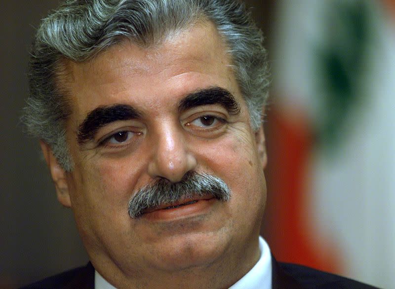 FILE PHOTO: Lebanese Prime Minister Rafik al-Hariri speaks during an interview with Reuters at his home in Beirut