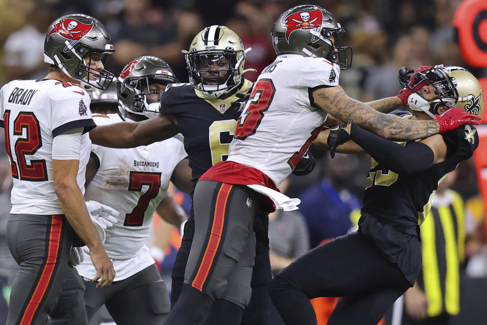 Tampa Bay Buccaneers wide receiver Mike Evans (13) and New Orleans Saints cornerback Marshon Lattimore (23) get into an altercation during the second half of an NFL football game, Sunday, Sept. 18, 2021, in New Orleans. (AP Photo/Jonathan Bachman)