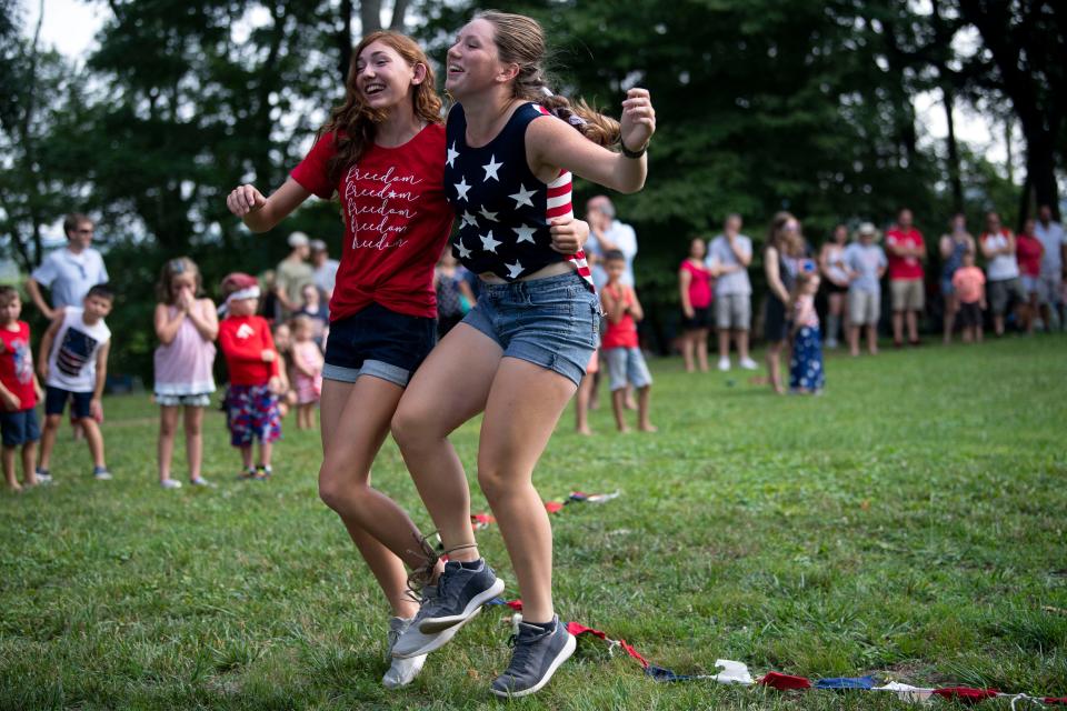 Emma Harrison and Anna Wart compete in the three-legged race at the Mabry-Hazen House Fourth of July on Mabry's Hill celebration on Sunday, July 4, 2021.