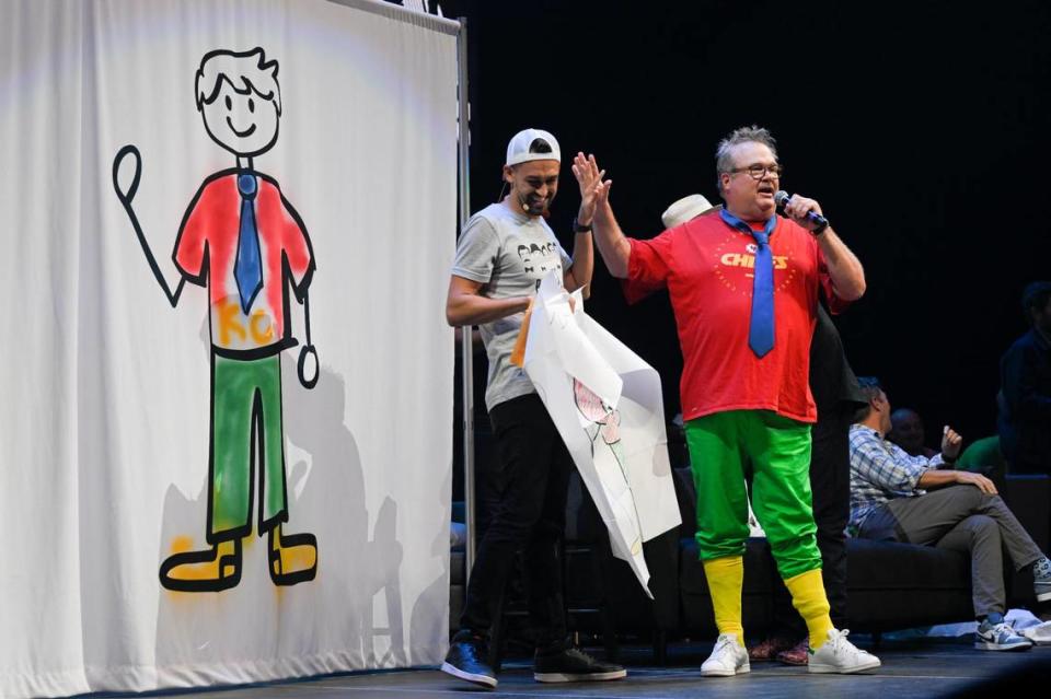 Eric Stonestreet, right, gave magician Blake Vogt a high five after assisting him in a bit of wizardry during the Big Slick show Saturday.