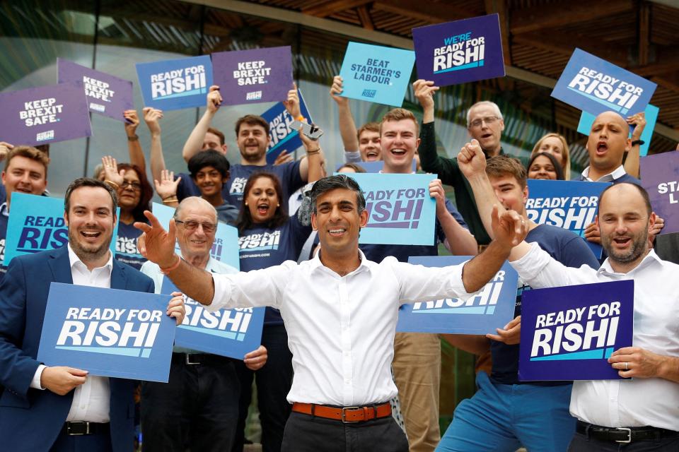 Britain's former chancellor to the exchequer, Rishi Sunak, center, with supporters ahead of attending a hustings event, part of the Conservative party leadership campaign, in Exeter, south-west England, on Aug. 1.