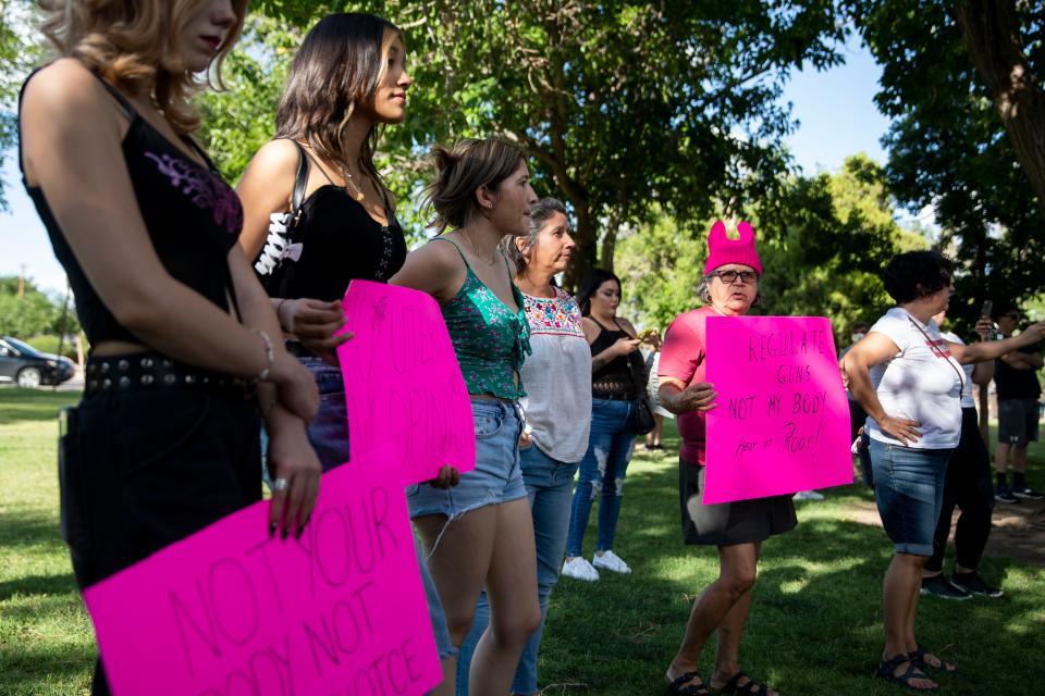 Demonstrators listen to abortion rights activists and other demonstrators share their feelings and fears about the overturning of Roe v. Wade during the Bans Off Las Cruces abortion rights demonstration on Friday, June 24, 2022. 