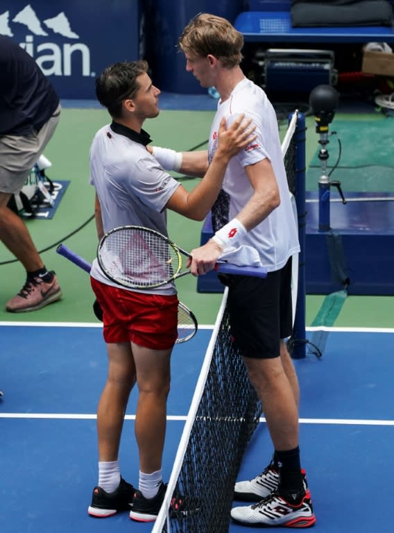 Tall story: Kevin Anderson congratulates Dominic Thiem