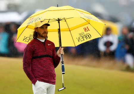 Golf - The 147th Open Championship - Carnoustie, Britain - July 20, 2018 England's Tommy Fleetwood holds an umbrella during the second round REUTERS/Andrew Yates