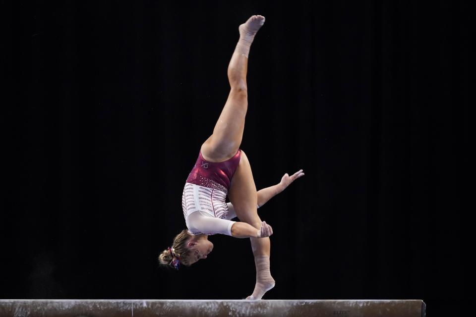 Oklahoma's Ragan Smith competes on the balance beam during the NCAA women's gymnastics championships, Thursday, April 14, 2022, in Fort Worth, Texas. (AP Photo/Tony Gutierrez)